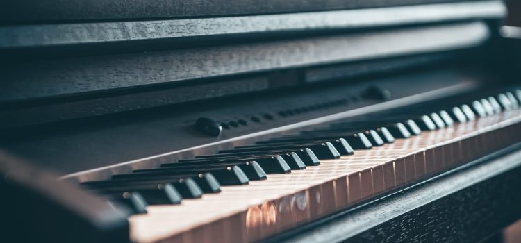 Close-up, electronic piano in a dark room.
